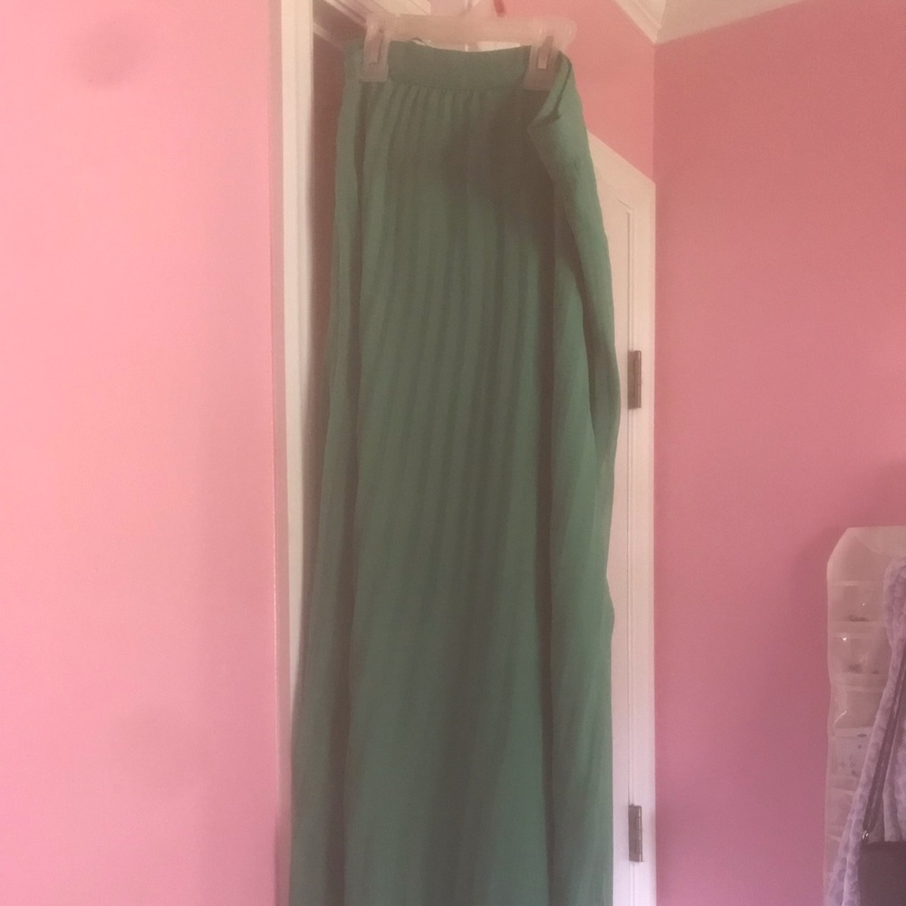 Green pleated maxi skirt